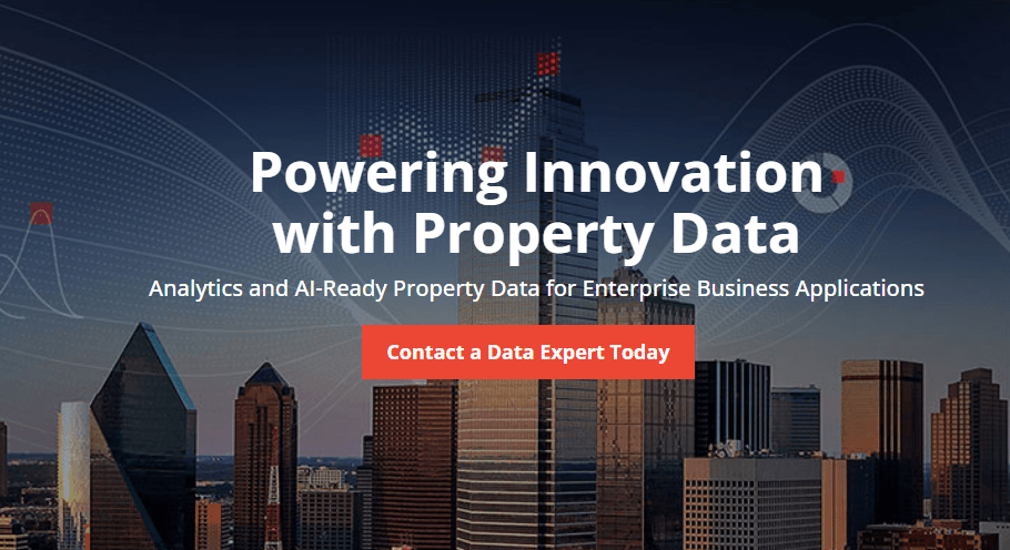 A city skyline with tall modern buildings, overlaid with digital data graphics, and the text: "Powering Innovation with Property Data – Analytics and AI-Ready Property Data for Enterprise Business Applications. Contact a Data Expert Today" in bold white and red lettering.