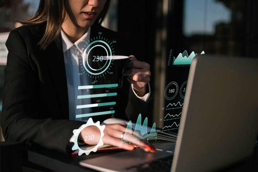 Business analyst reviews charts and data on a laptop, highlighting Free real estate data quality and reliability considerations.