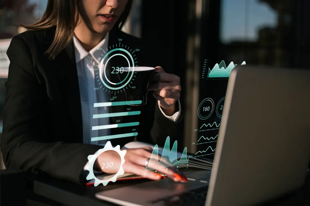 Business analyst reviews charts and data on a laptop, highlighting Free real estate data quality and reliability considerations.