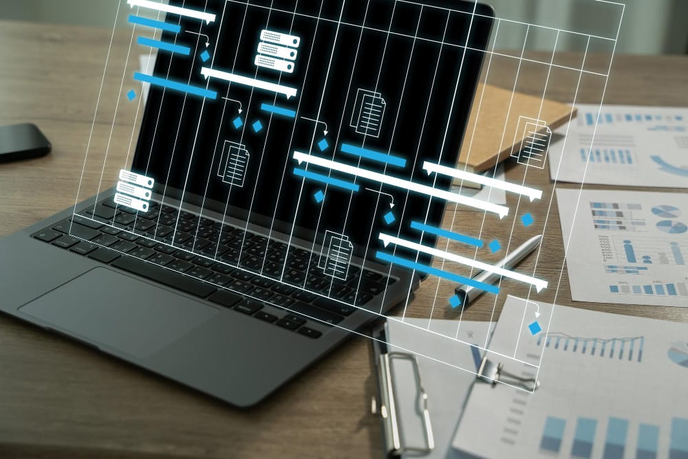 Laptop displaying project charts and documents, symbolizing Free real estate data for informed decision-making and analysis.