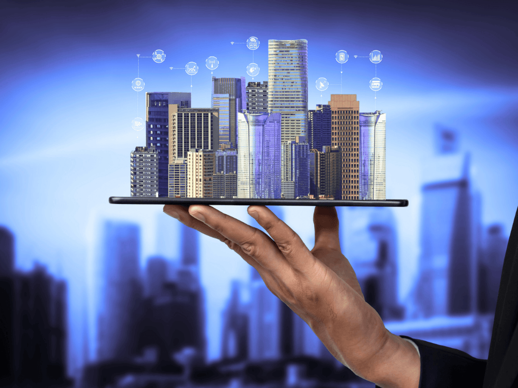 Business hand holding digital tablet displaying smart city buildings, illustrating AI-powered real estate investment analysis and digital property intelligence