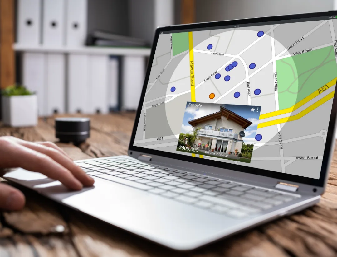 How to Find Rental Properties With AI (2026) 2 Laptop screen displaying interactive property map with listings and location pins for investment property research