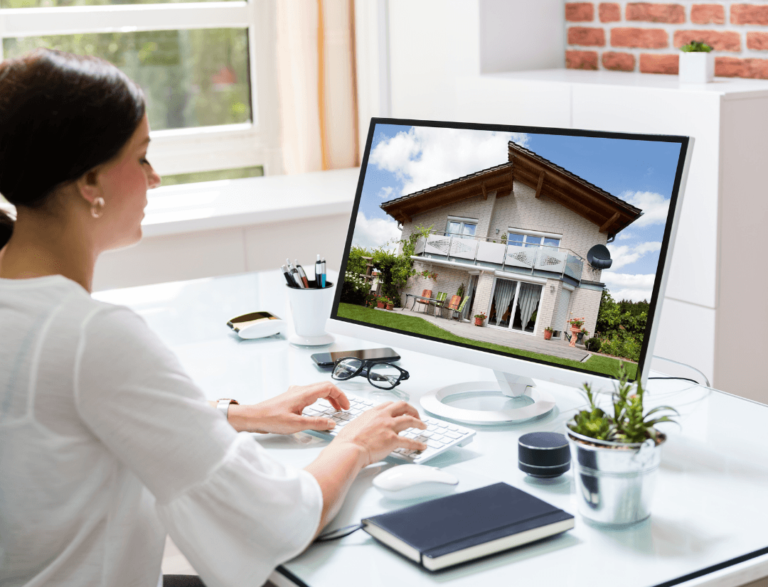 Real estate wholesaler analyzing off-market property on computer