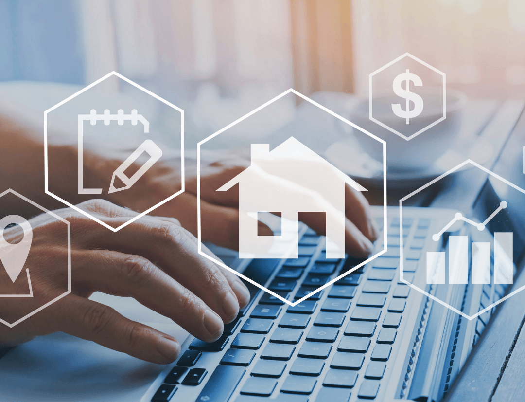 Person typing on a laptop with digital real estate icons showing house value, pricing and analytics over the keyboard