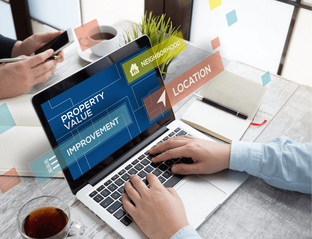 Long-Term vs. Short-Term Rental Investment Potential: How to Decide in 2026 2 Investor reviewing property investment potential data on a laptop, including location and neighborhood factors.
