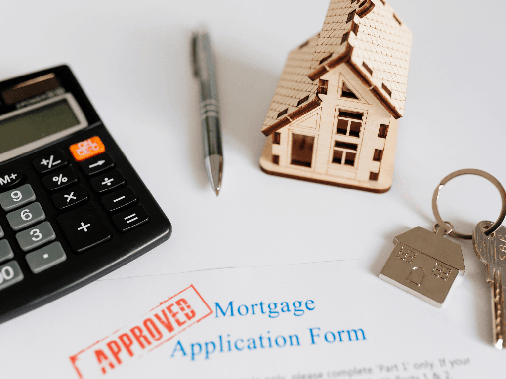 Approved mortgage application on white desk — 