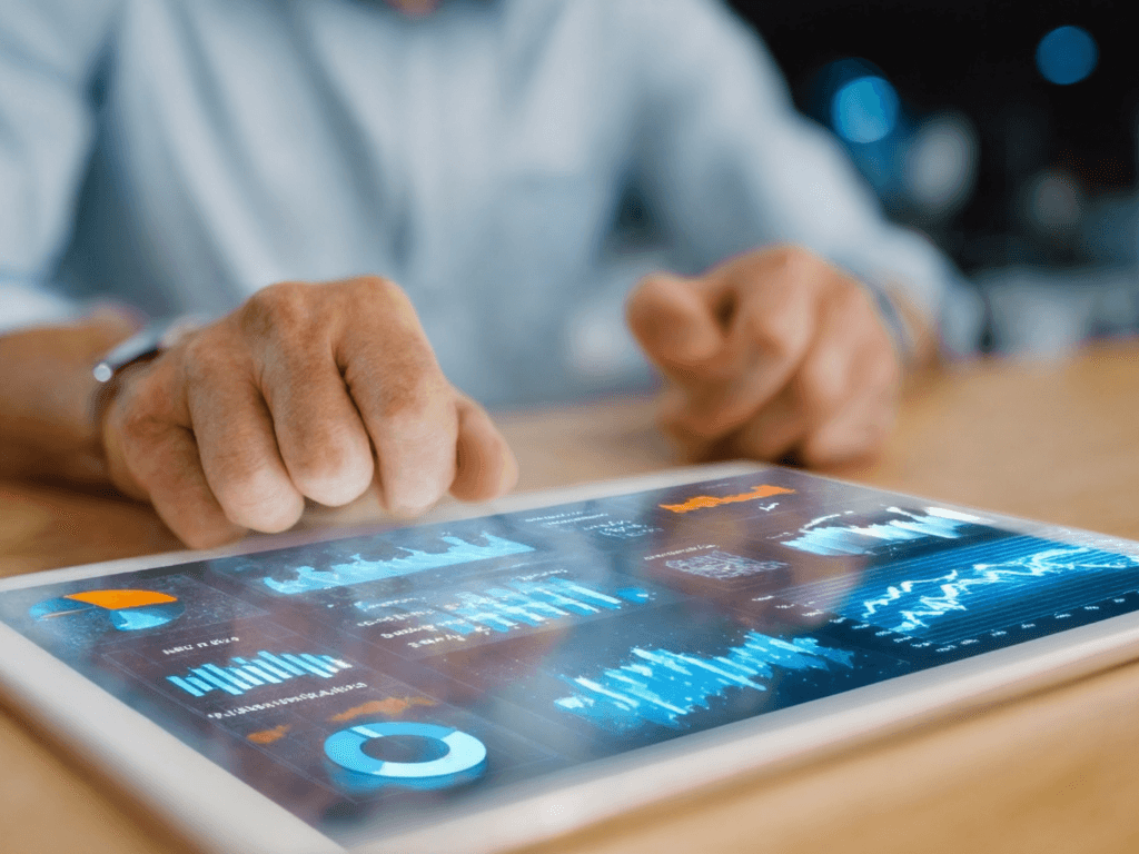 Investor using a tablet with predictive real estate analytics dashboards to review property performance and cash flow projections.