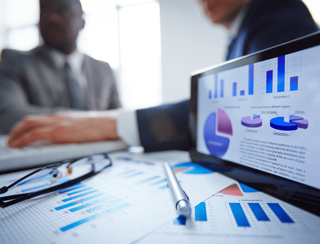 Computer screen displaying real estate market analytics and investment metrics dashboard