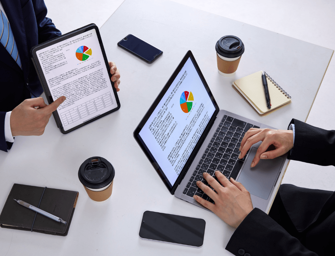 Professionals using AI tools to analyze house flipping investment returns and renovation budgets 