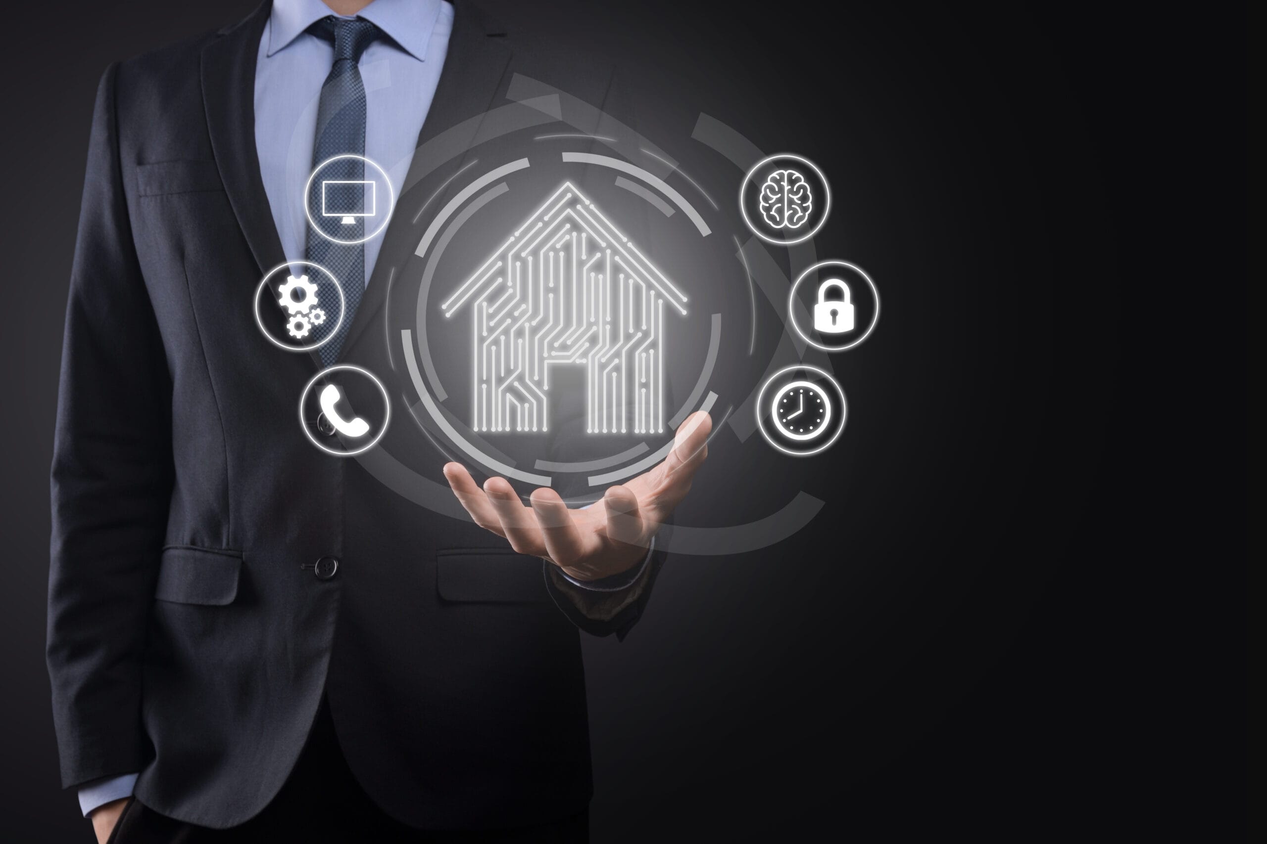 AI-powered property intelligence platform — businessman holding smart home icon with automated valuation technology symbols